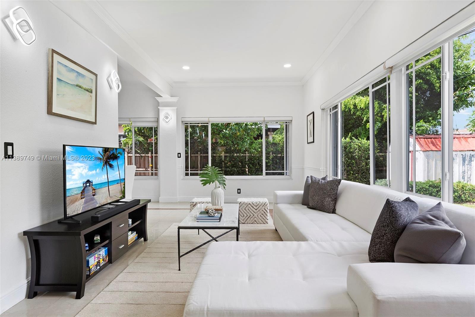 2201 Southwest 84th Avenue Miami, FL 33155 - Photo 6 of 33 a living room with furniture and a flat screen tv