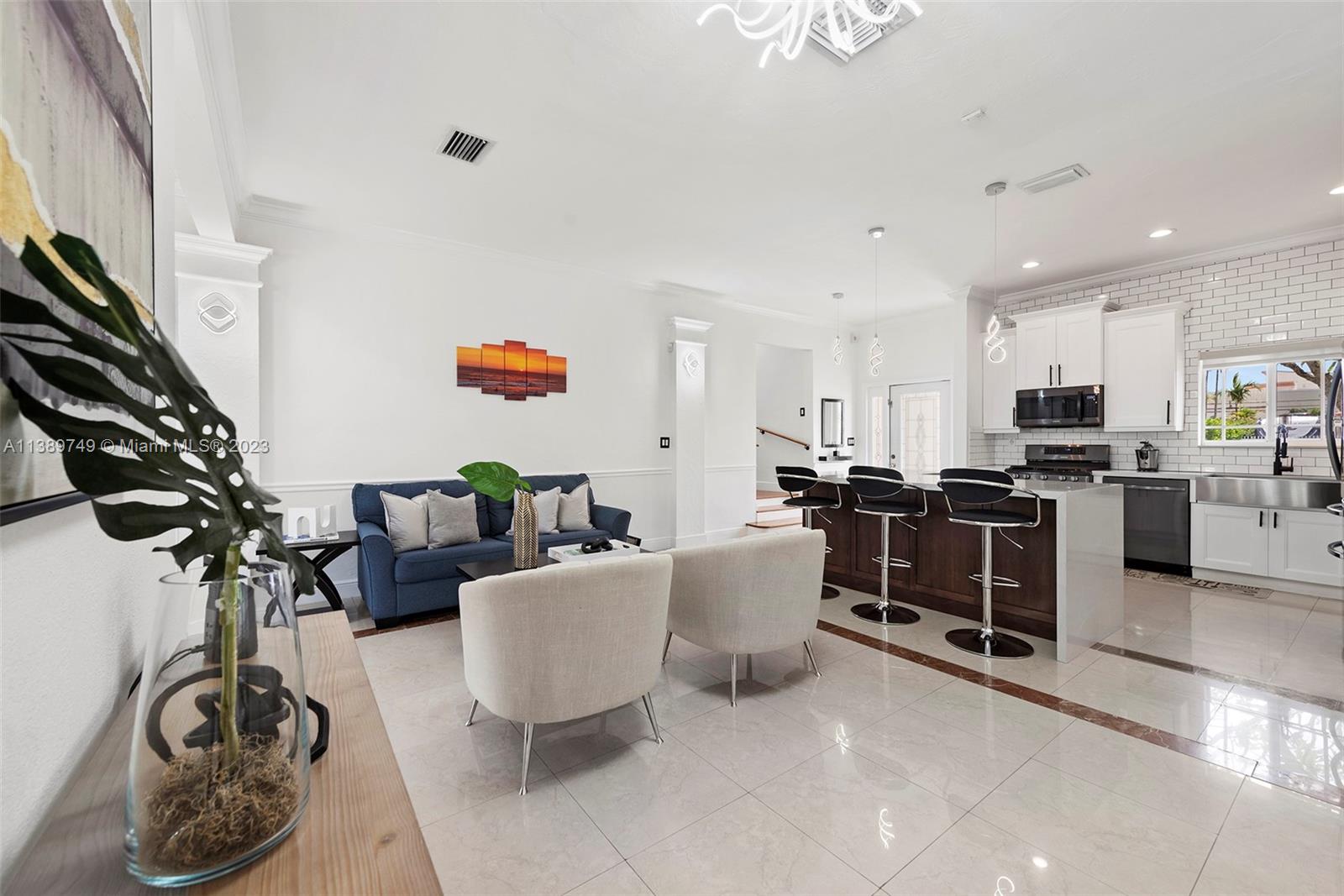 2201 Southwest 84th Avenue Miami, FL 33155 - Photo 8 of 33 a living room with furniture kitchen view and a potted plant