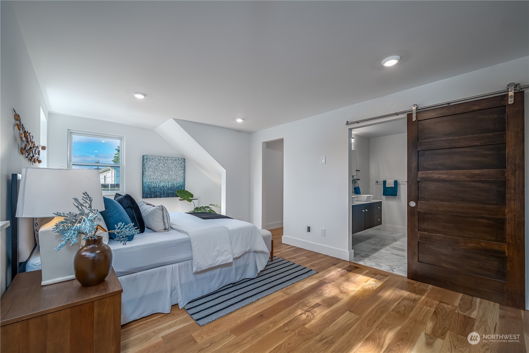 3919 Southwest Monroe Street Seattle, WA 98136 - Photo 15 of 40 a bedroom with a bed and a walk in closet