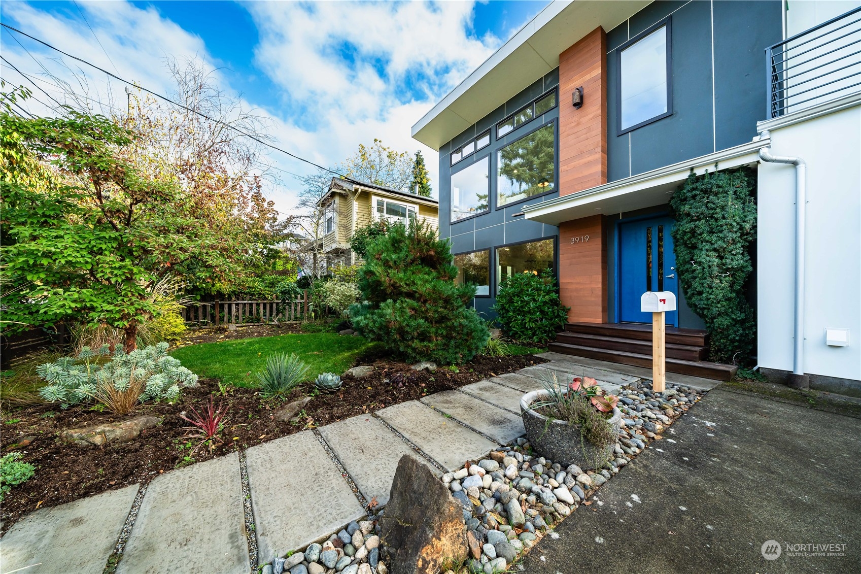3919 Southwest Monroe Street Seattle, WA 98136 - Photo 2 of 40 a wooden bench sitting in front of a building