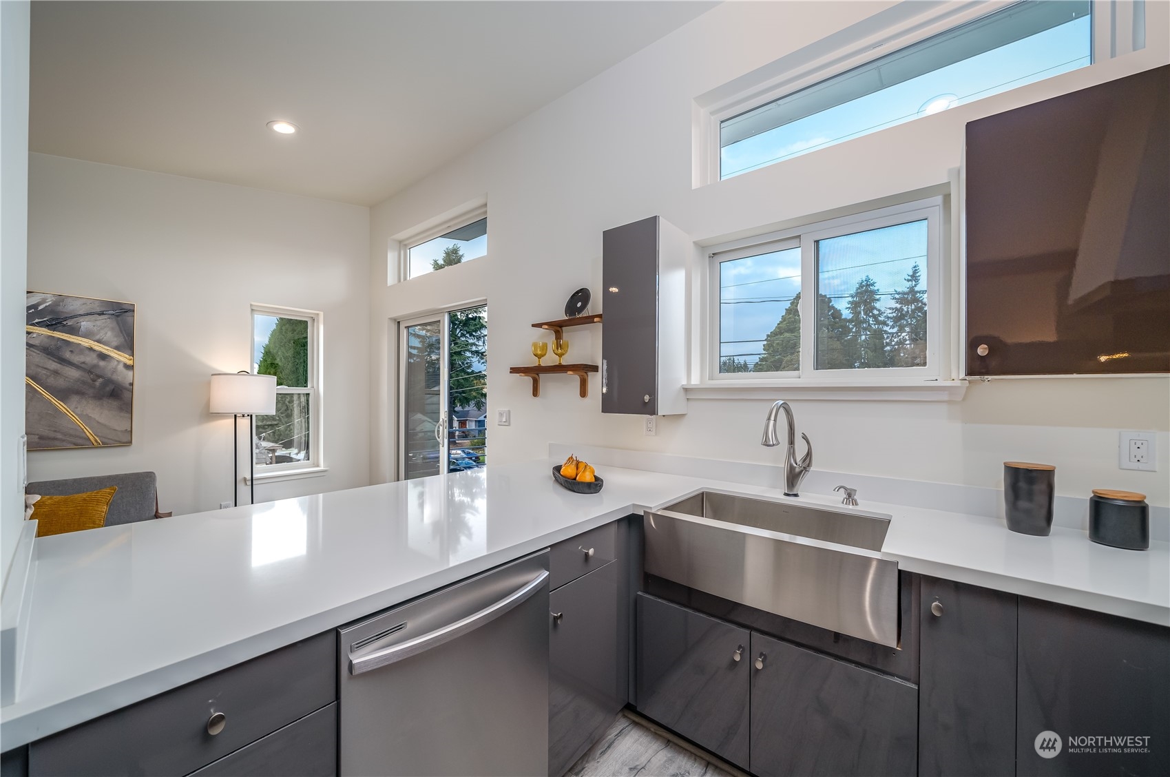 3919 Southwest Monroe Street Seattle, WA 98136 - Photo 28 of 40 a kitchen with a sink stove and cabinets