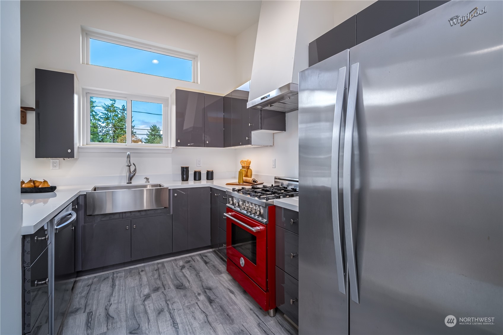 3919 Southwest Monroe Street Seattle, WA 98136 - Photo 29 of 40 a kitchen with cabinets a sink and stainless steel appliances