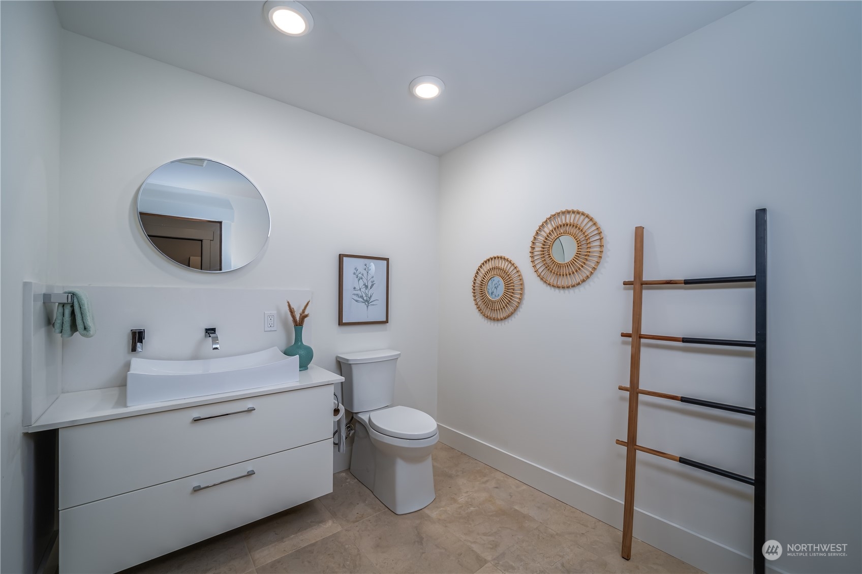 3919 Southwest Monroe Street Seattle, WA 98136 - Photo 32 of 40 a bathroom with a toilet sink vanity and mirror