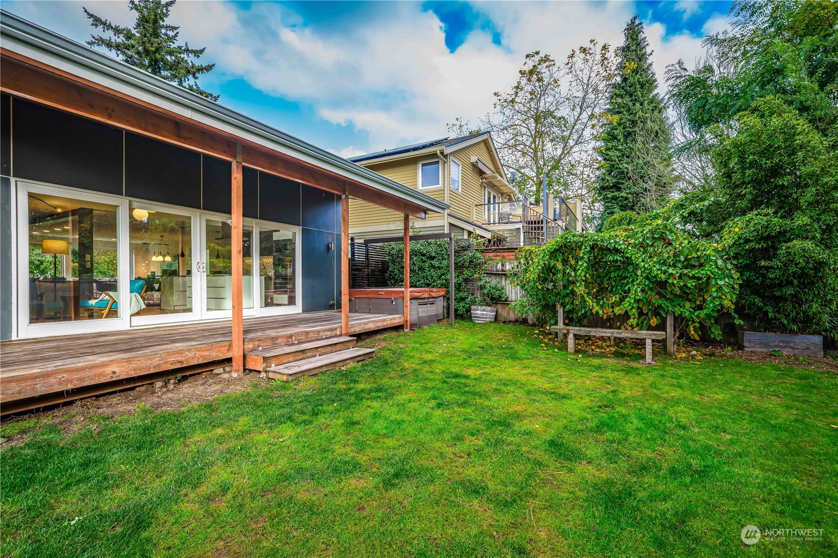3919 Southwest Monroe Street Seattle, WA 98136 - Photo 35 of 40 a view of a house with a backyard porch and sitting area