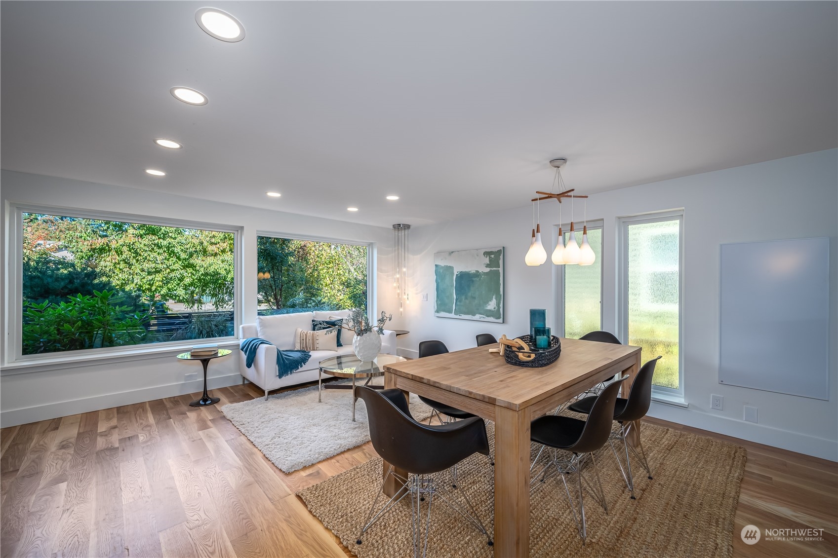 3919 Southwest Monroe Street Seattle, WA 98136 - Photo 6 of 40 a view of a dining room with furniture window and wooden floor
