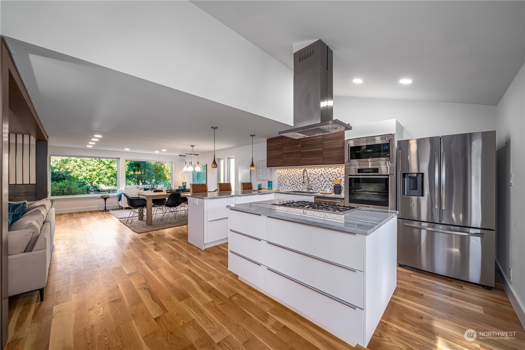3919 Southwest Monroe Street Seattle, WA 98136 - Photo 9 of 40 a kitchen with a refrigerator and a view of living room