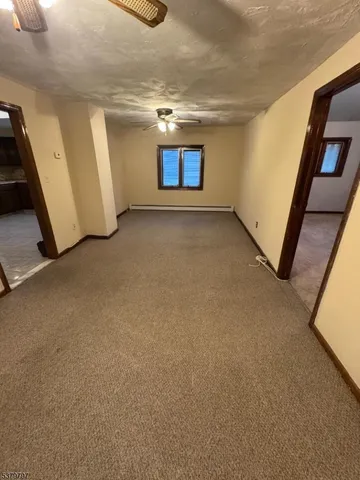 a view of a room with window and stairs