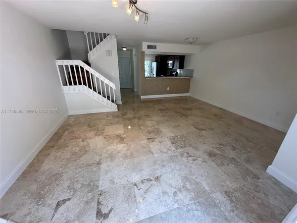 a view of a hallway with staircase