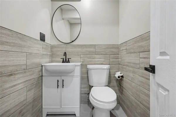 a bathroom with a toilet and a sink