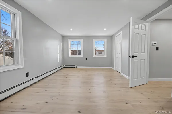 a view of an empty room with a window