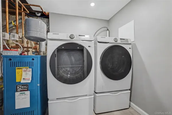 a utility room with dryer and washer