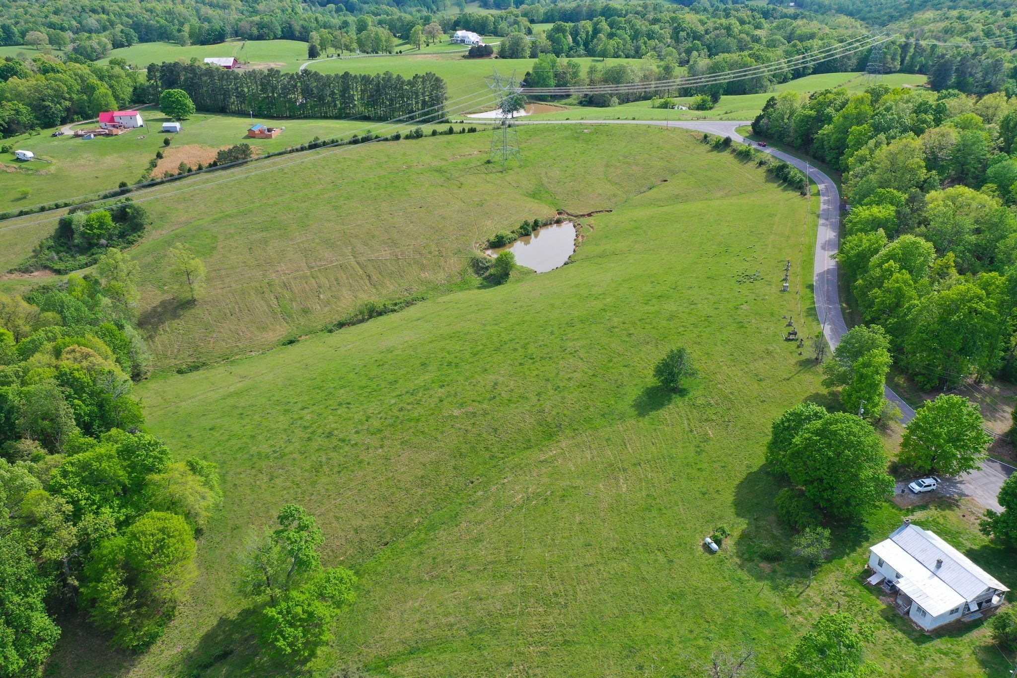 3915 Oak Ridge Road Palmyra, TN 37142 - Photo 41 of 61 a view of a golf course with a lake view