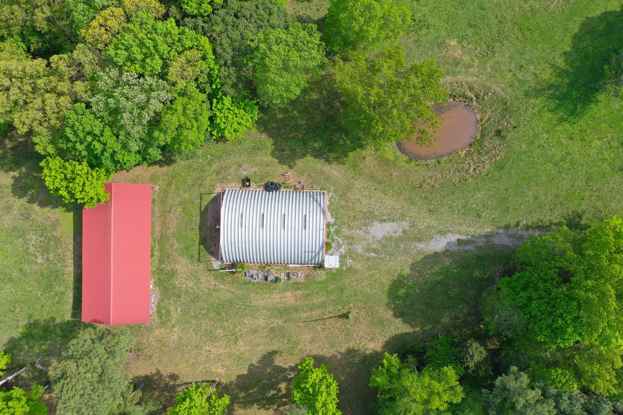 3915 Oak Ridge Road Palmyra, TN 37142 - Photo 42 of 61 a view of a swimming pool in he middle of the green field