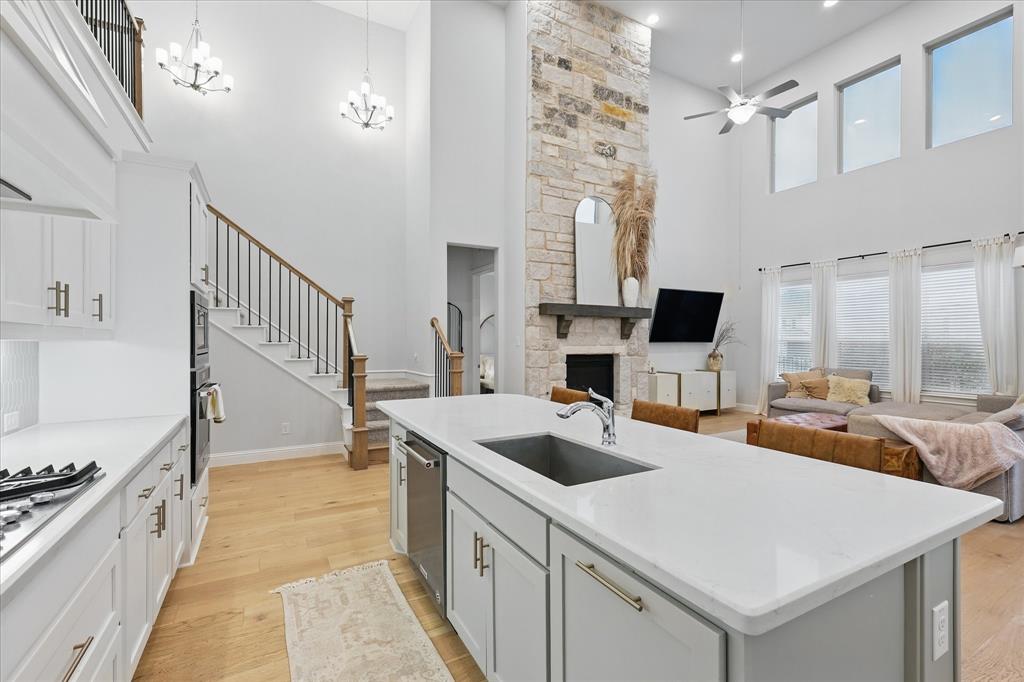 618 Race Drive Forney, TX 75126 - Photo 10 of 39 a kitchen with a stove a sink and a refrigerator