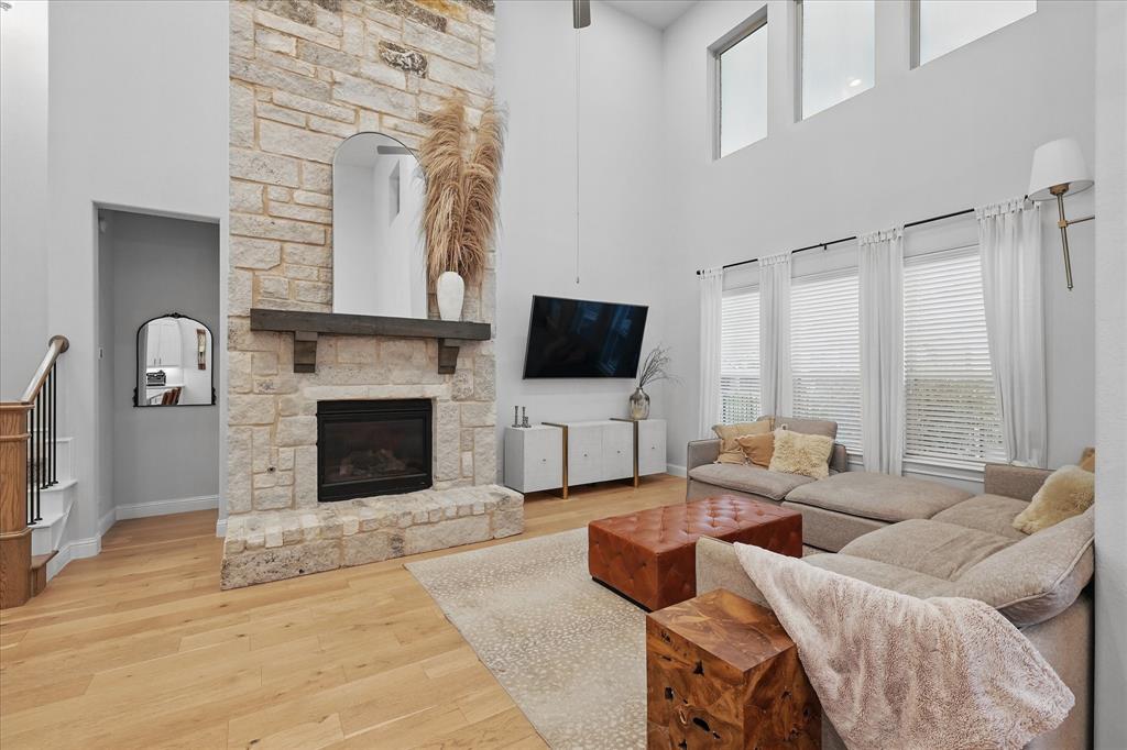 618 Race Drive Forney, TX 75126 - Photo 11 of 39 a living room with furniture a fireplace and a flat screen tv