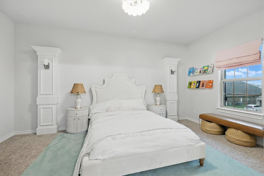 618 Race Drive Forney, TX 75126 - Photo 19 of 39 a spacious bedroom with two bed and a large window
