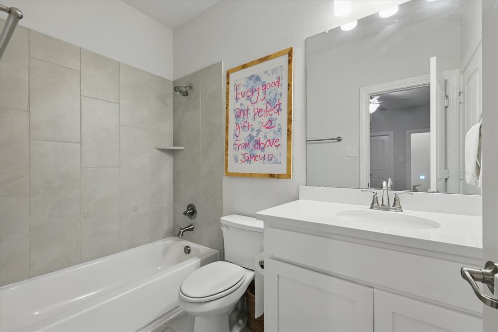 618 Race Drive Forney, TX 75126 - Photo 21 of 39 a bathroom with a sink a toilet and shower