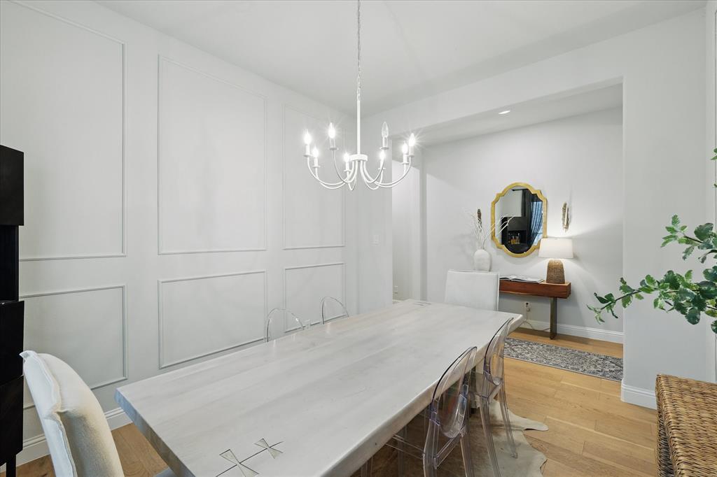 618 Race Drive Forney, TX 75126 - Photo 6 of 39 a bedroom with a bed and a chandelier