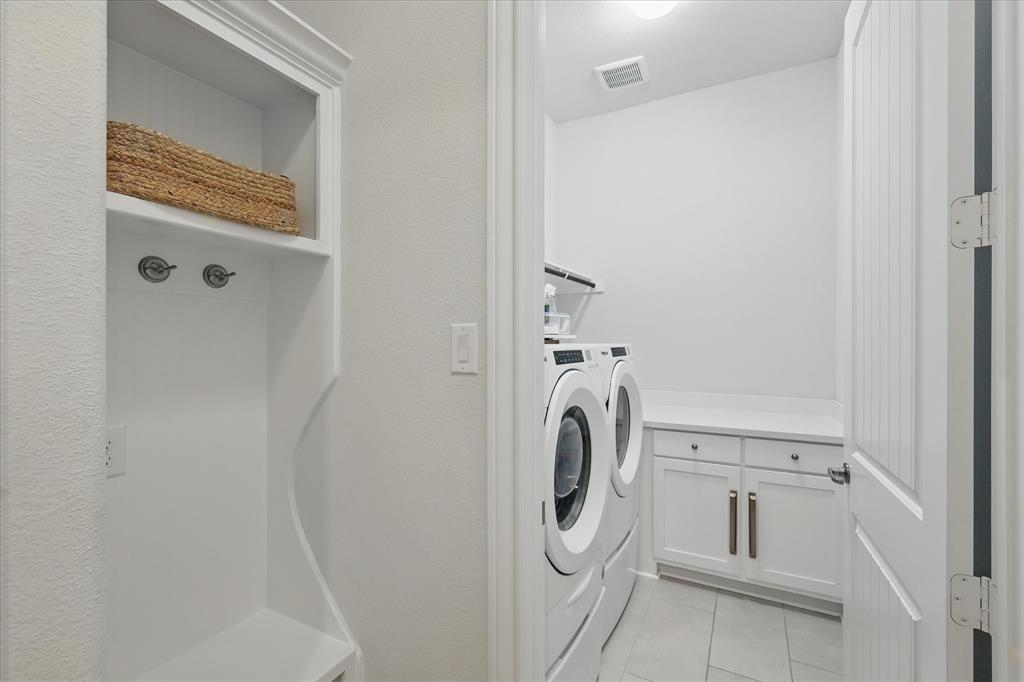 618 Race Drive Forney, TX 75126 - Photo 7 of 39 a utility room with dryer and washer