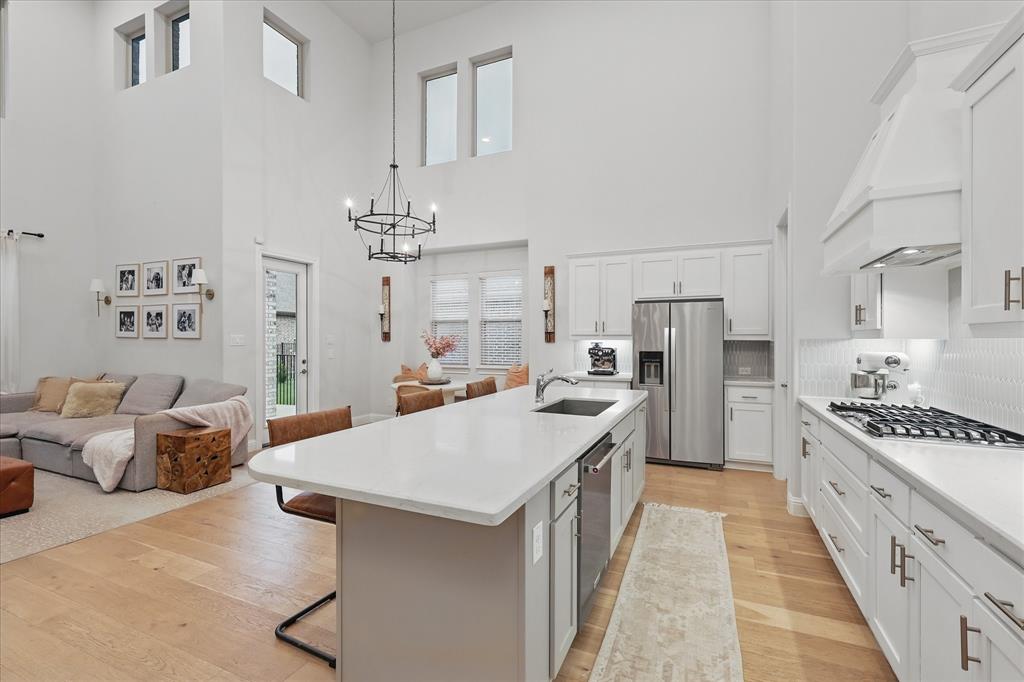 618 Race Drive Forney, TX 75126 - Photo 38 of 39 a kitchen with furniture and a chandelier