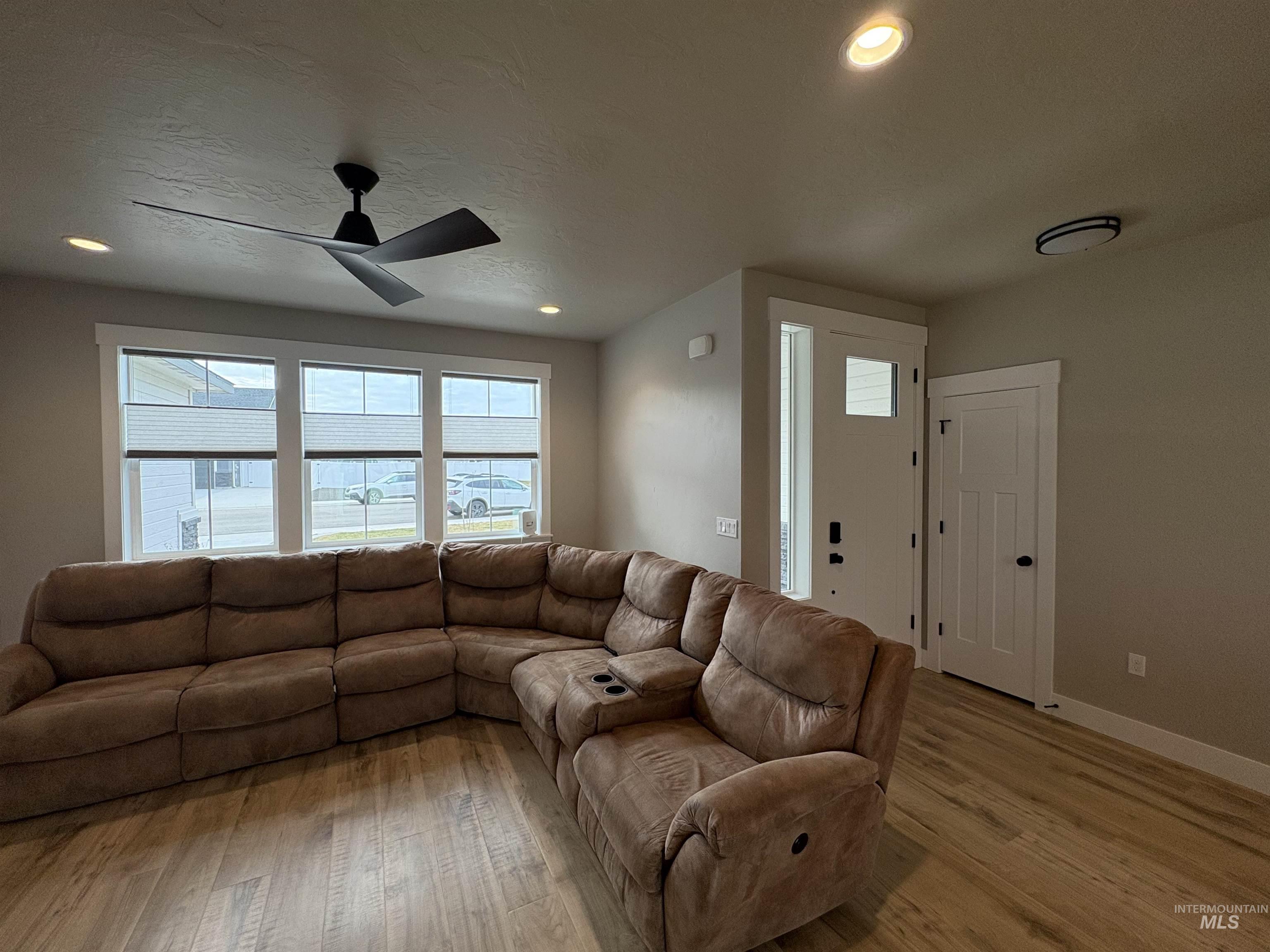 2184 Austin Way Fruitland, ID 83619 - Photo 15 of 34 Living room featuring ceiling fan, light wood-type flooring, and recessed lighting