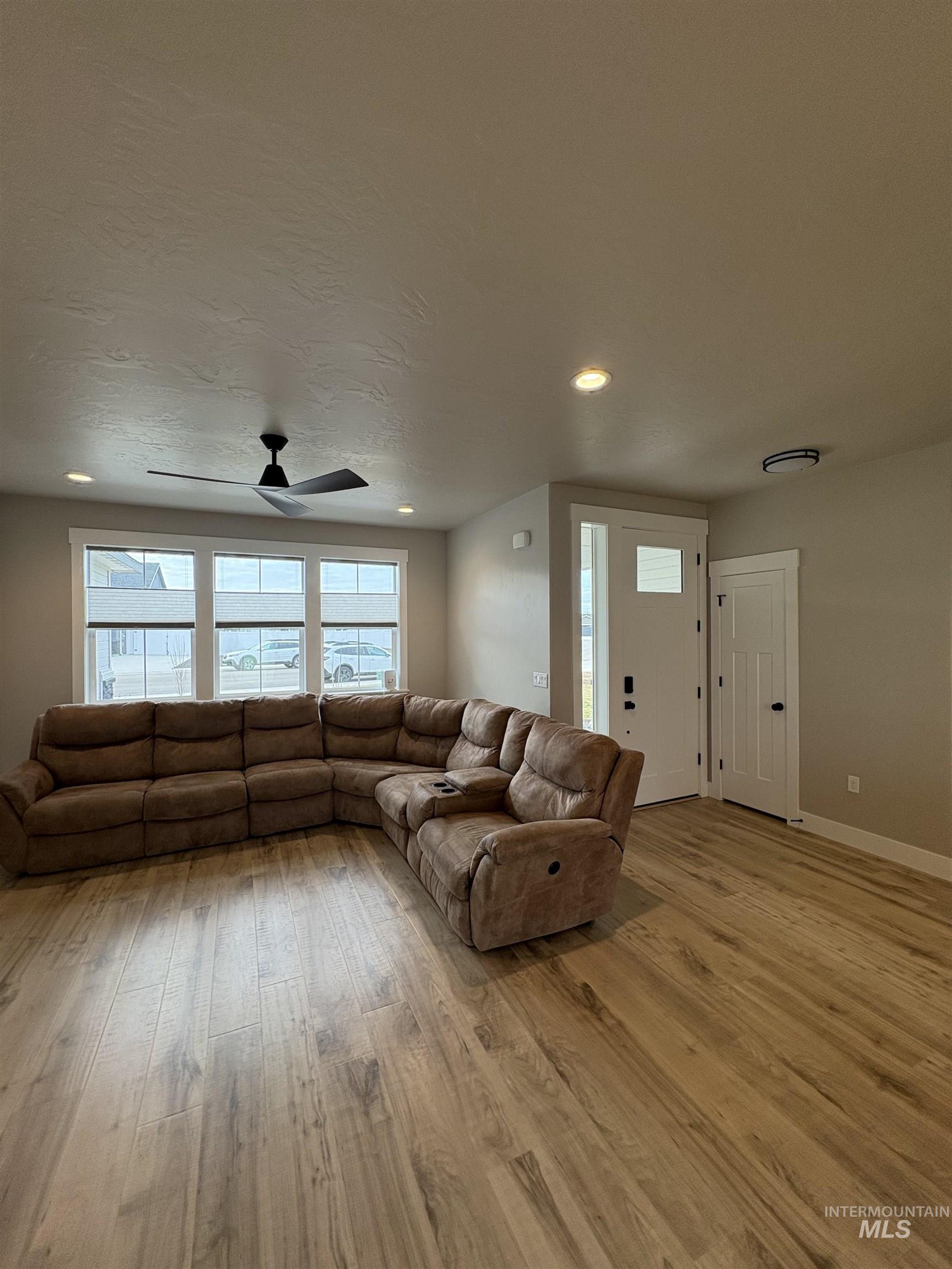 2184 Austin Way Fruitland, ID 83619 - Photo 17 of 34 Living room featuring light wood-type flooring, recessed lighting, and ceiling fan
