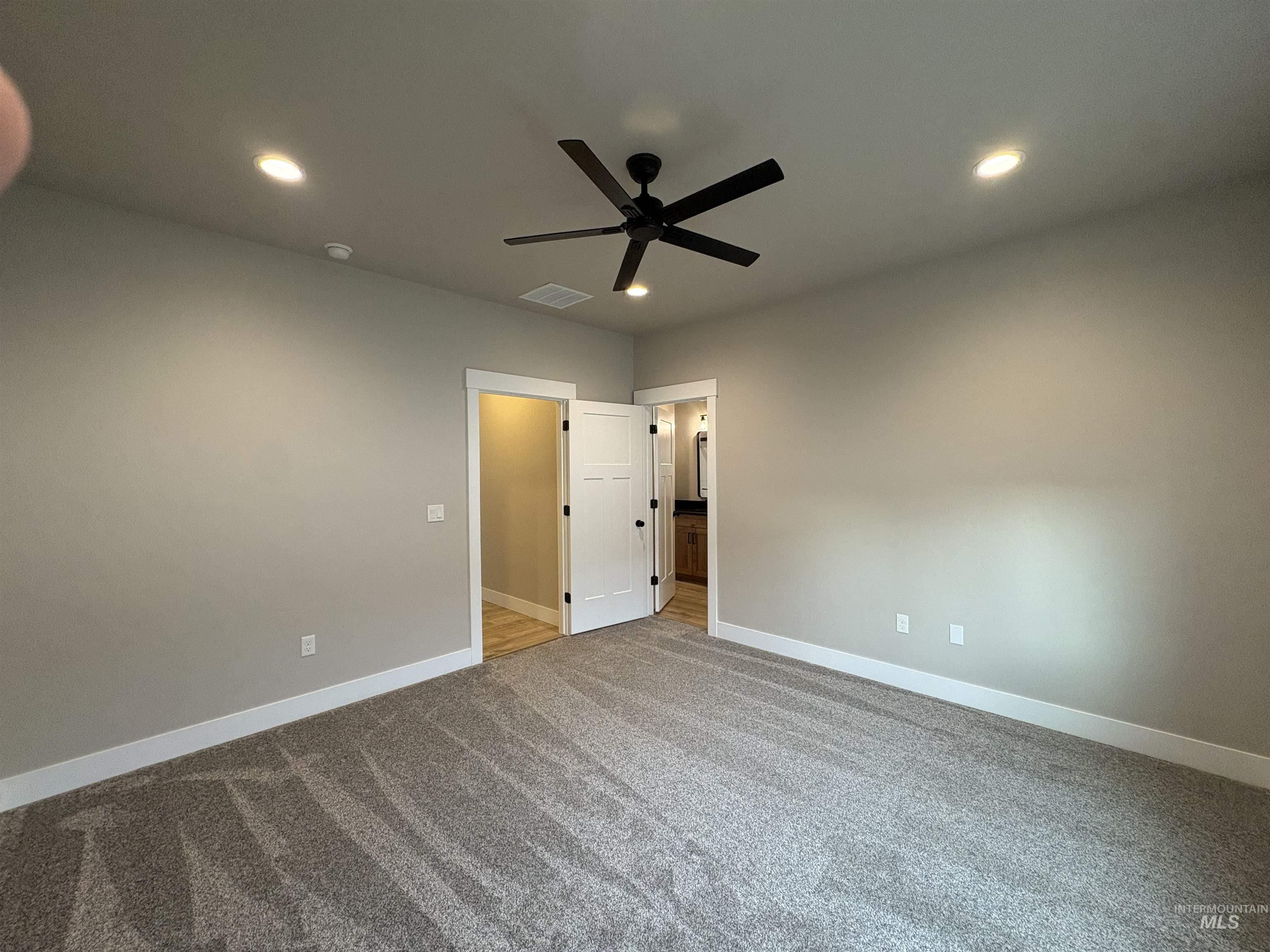 2184 Austin Way Fruitland, ID 83619 - Photo 20 of 34 Unfurnished bedroom with light carpet, a ceiling fan, and recessed lighting