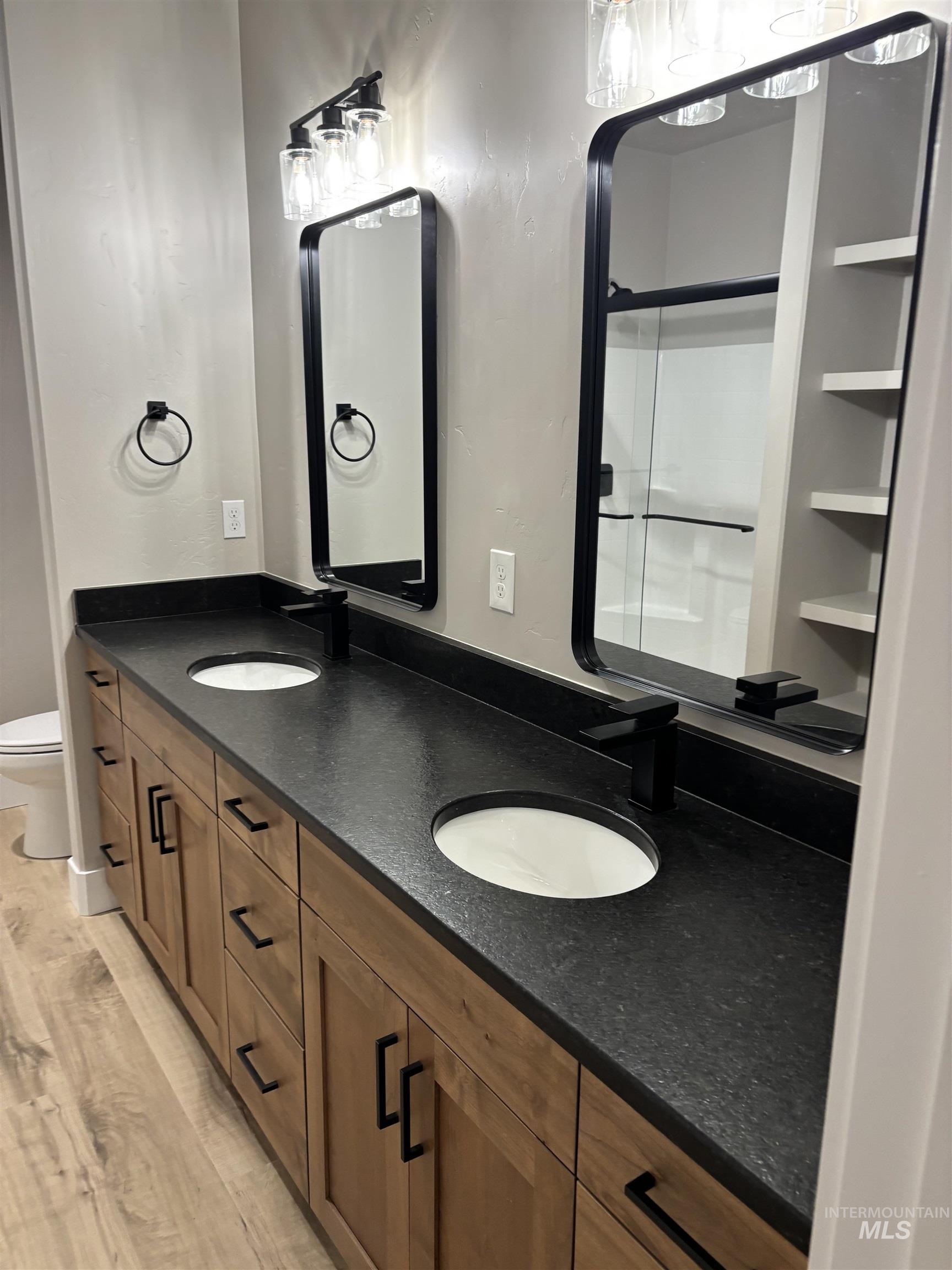 2184 Austin Way Fruitland, ID 83619 - Photo 21 of 34 Bathroom with double vanity and light wood finished floors