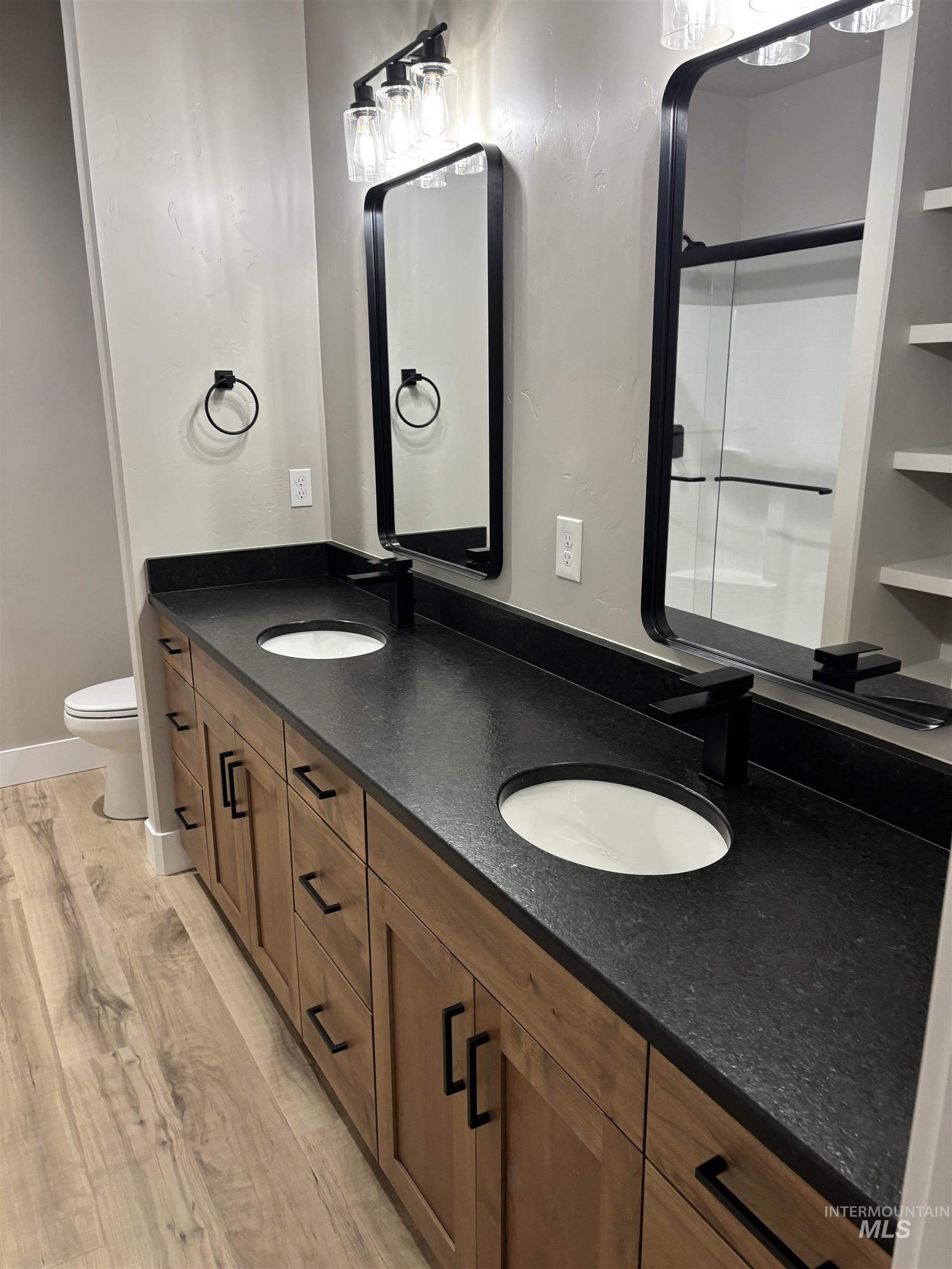 2184 Austin Way Fruitland, ID 83619 - Photo 22 of 34 Bathroom featuring light wood-style floors and double vanity
