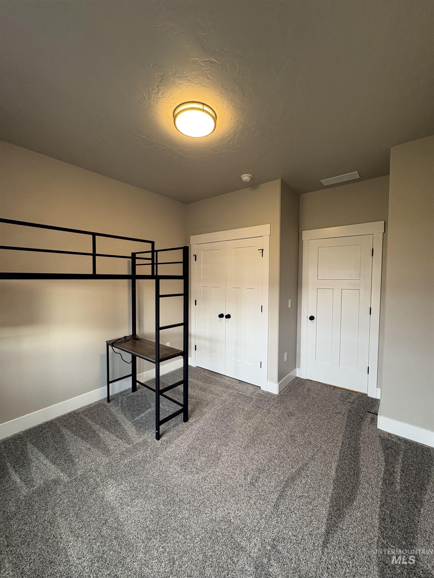 2184 Austin Way Fruitland, ID 83619 - Photo 25 of 34 Unfurnished bedroom featuring carpet flooring and a closet