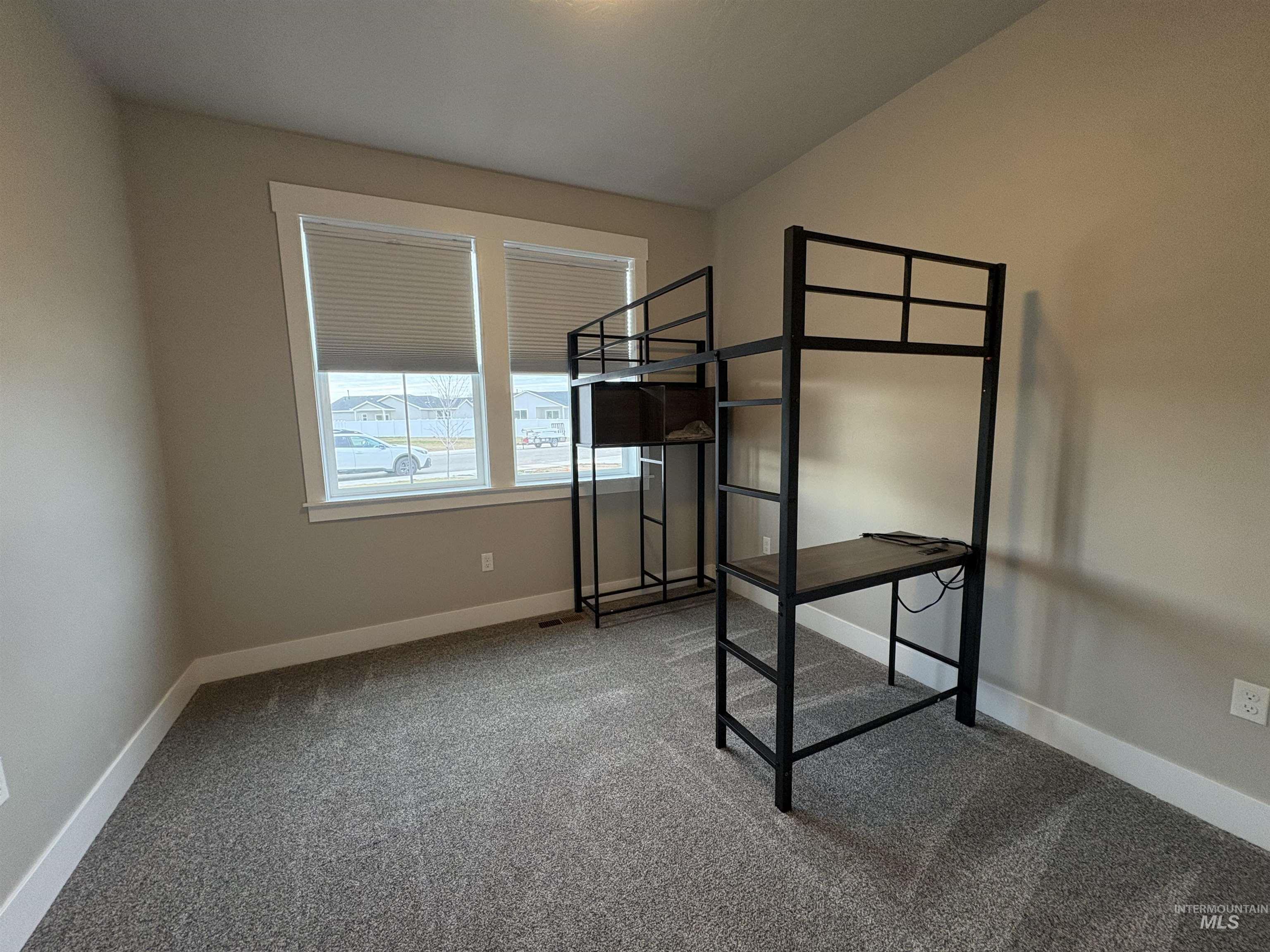 2184 Austin Way Fruitland, ID 83619 - Photo 26 of 34 Unfurnished bedroom featuring carpet flooring and baseboards