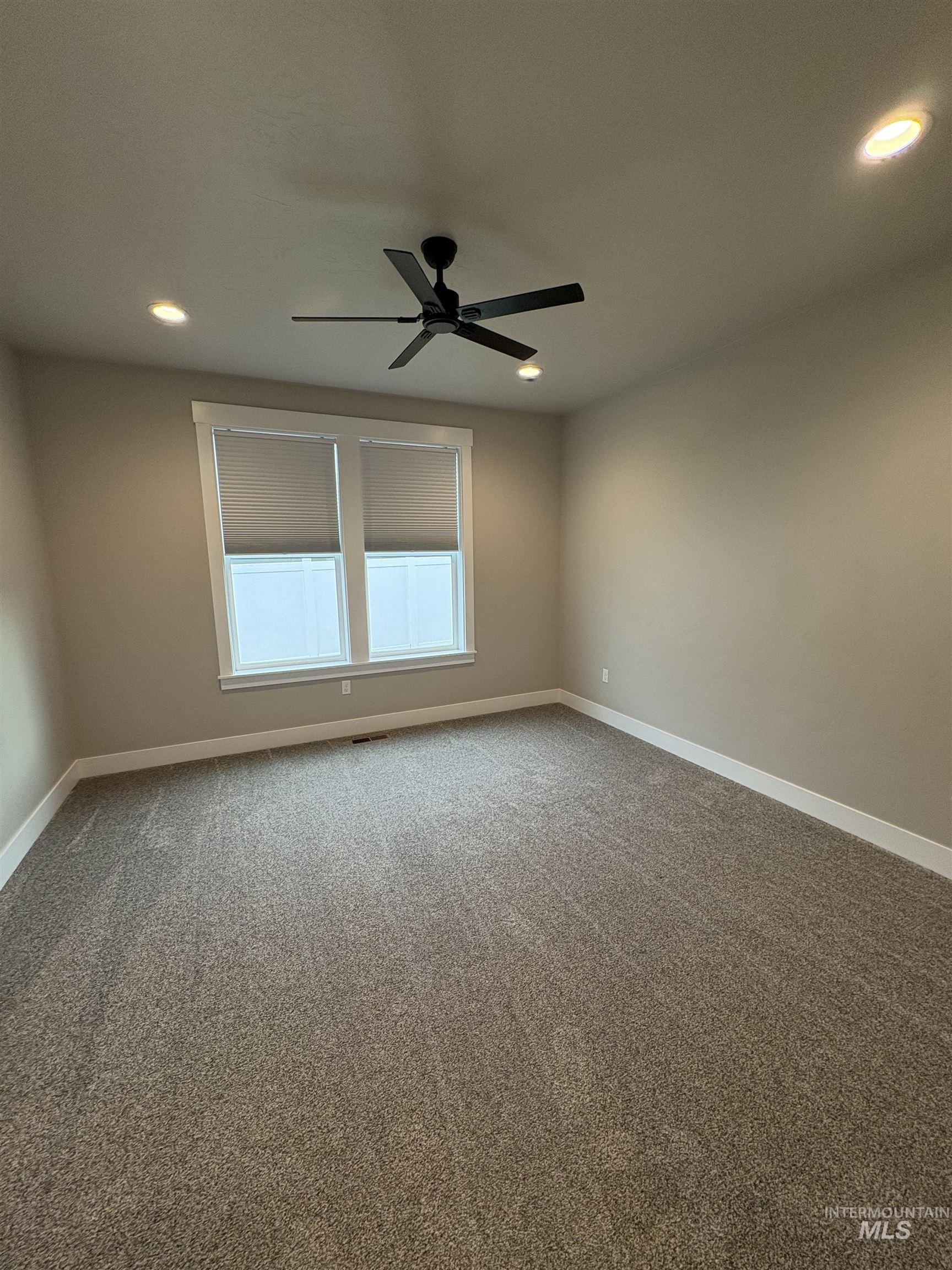 2184 Austin Way Fruitland, ID 83619 - Photo 27 of 34 Spare room with carpet flooring, ceiling fan, and recessed lighting