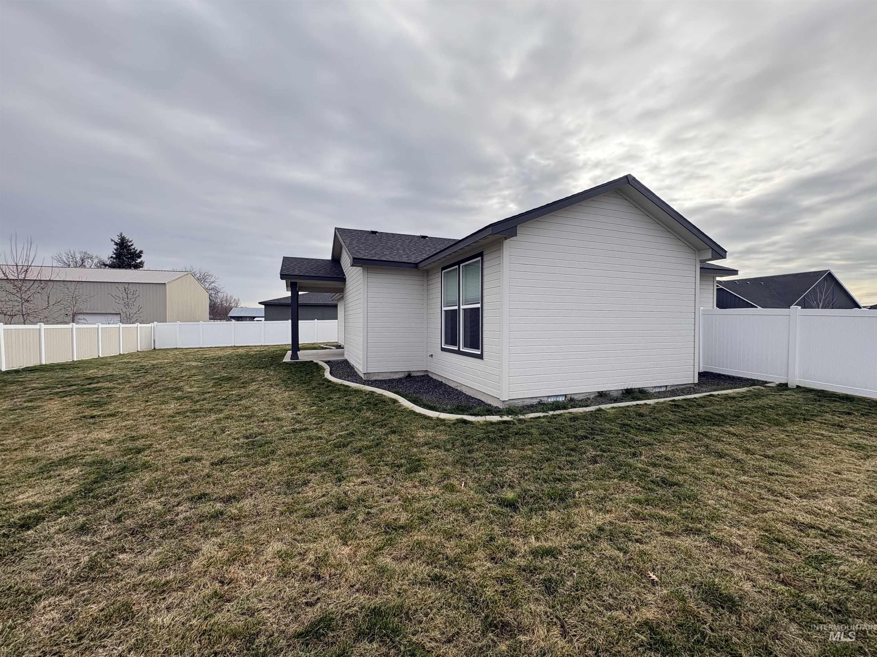 2184 Austin Way Fruitland, ID 83619 - Photo 31 of 34 View of property exterior featuring a fenced backyard