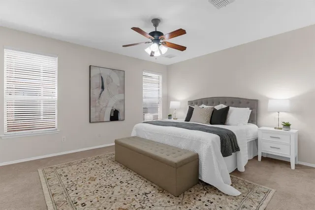 a bedroom with a bed and window