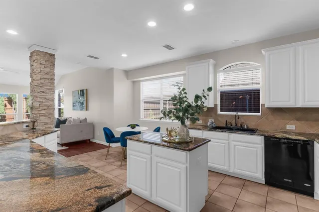 a kitchen with sink refrigerator and microwave