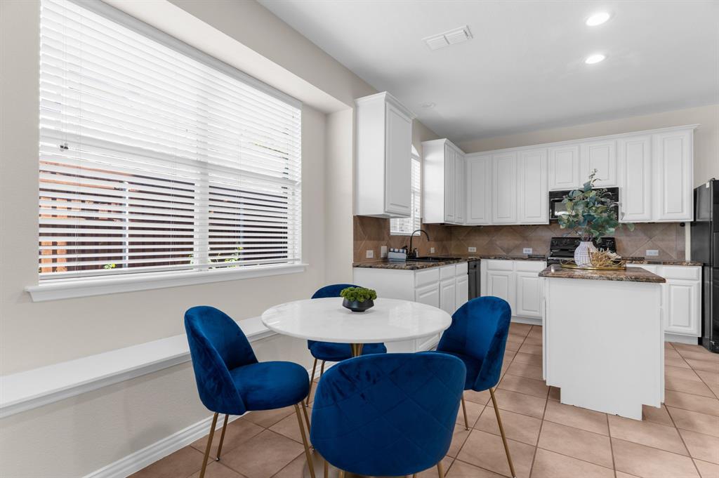 4607 Forest Park Road Plano, TX 75024 - Photo 23 of 40 a kitchen with a table chairs and a window