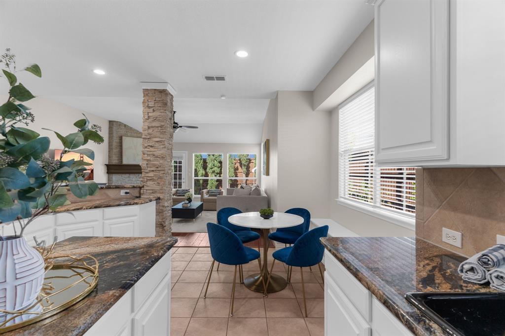 4607 Forest Park Road Plano, TX 75024 - Photo 24 of 40 a living room with furniture and a potted plant