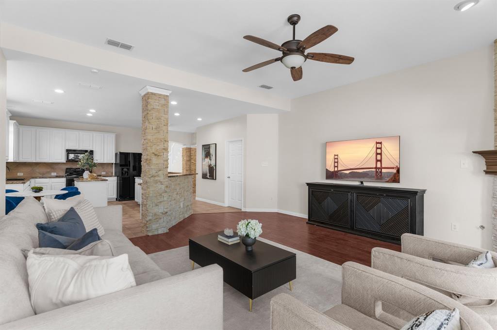 4607 Forest Park Road Plano, TX 75024 - Photo 29 of 40 a living room with furniture and a flat screen tv
