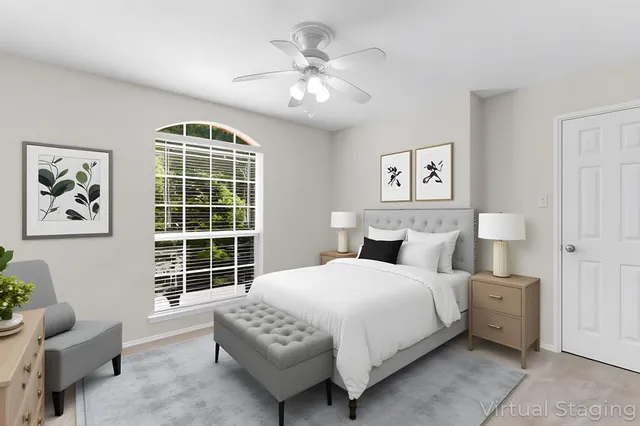 a bedroom with a bed and a couch