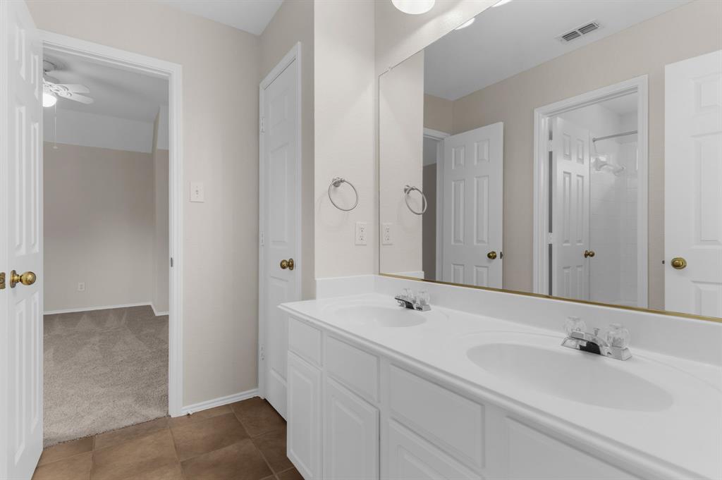 4607 Forest Park Road Plano, TX 75024 - Photo 33 of 40 a bathroom with a sink and a tub