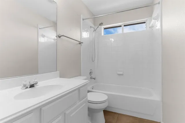 a bathroom with a sink a toilet and a bathtub