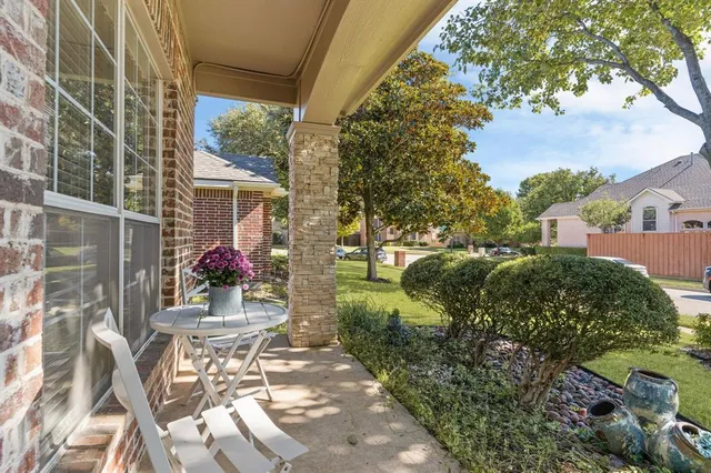 a view of backyard with patio