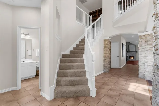 a view of entryway and hall with a front door