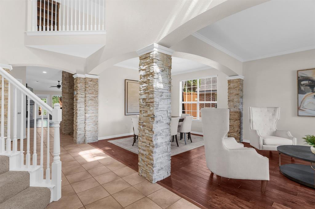 4607 Forest Park Road Plano, TX 75024 - Photo 6 of 40 a living room with couches and glass door with wooden floor