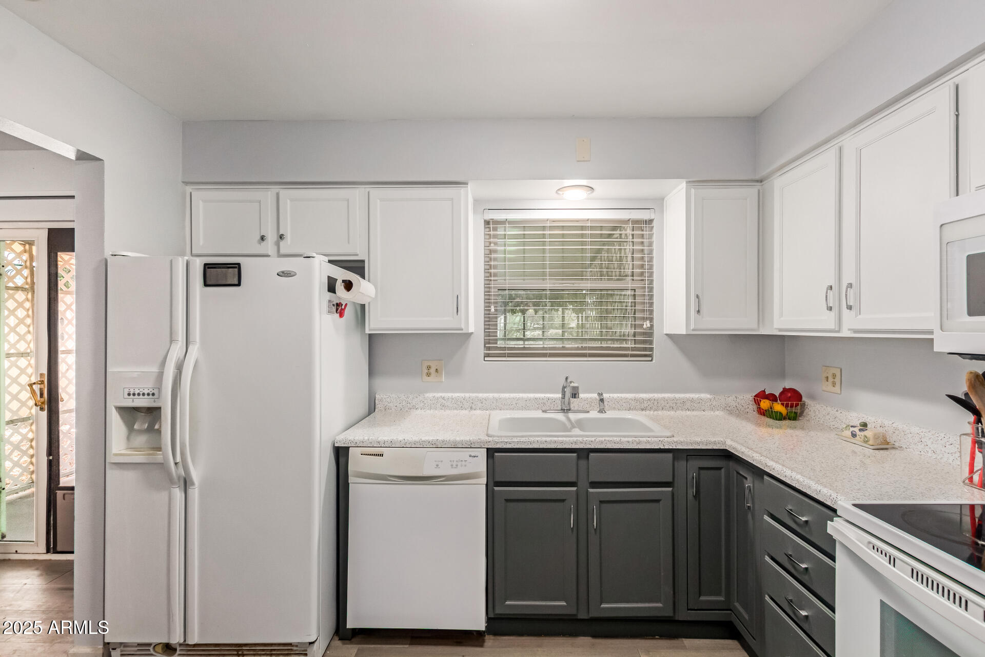 6149 East Decatur Street Mesa, AZ 85205 - Photo 11 of 24 a utility room with cabinets washer and dryer