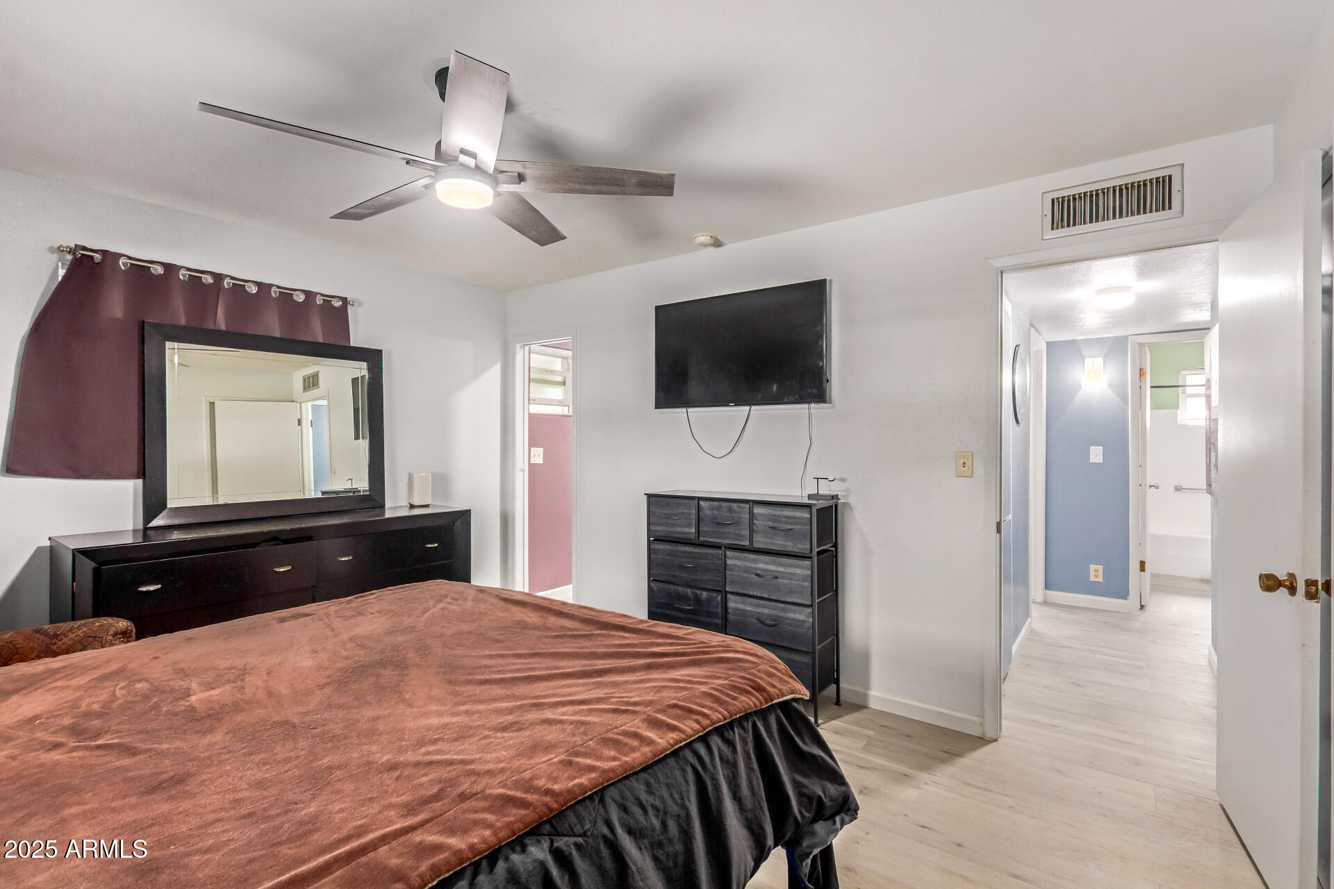 6149 East Decatur Street Mesa, AZ 85205 - Photo 14 of 24 a bedroom with a bed and a flat screen tv