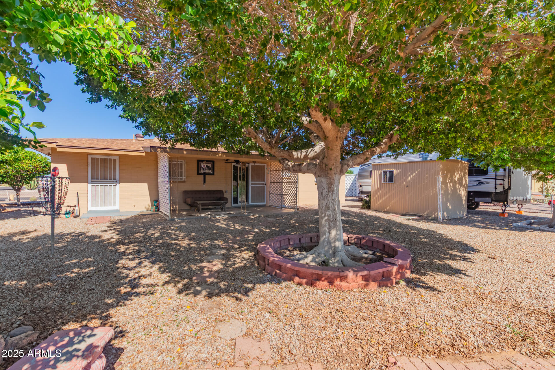 6149 East Decatur Street Mesa, AZ 85205 - Photo 24 of 24 a front view of a house with garden