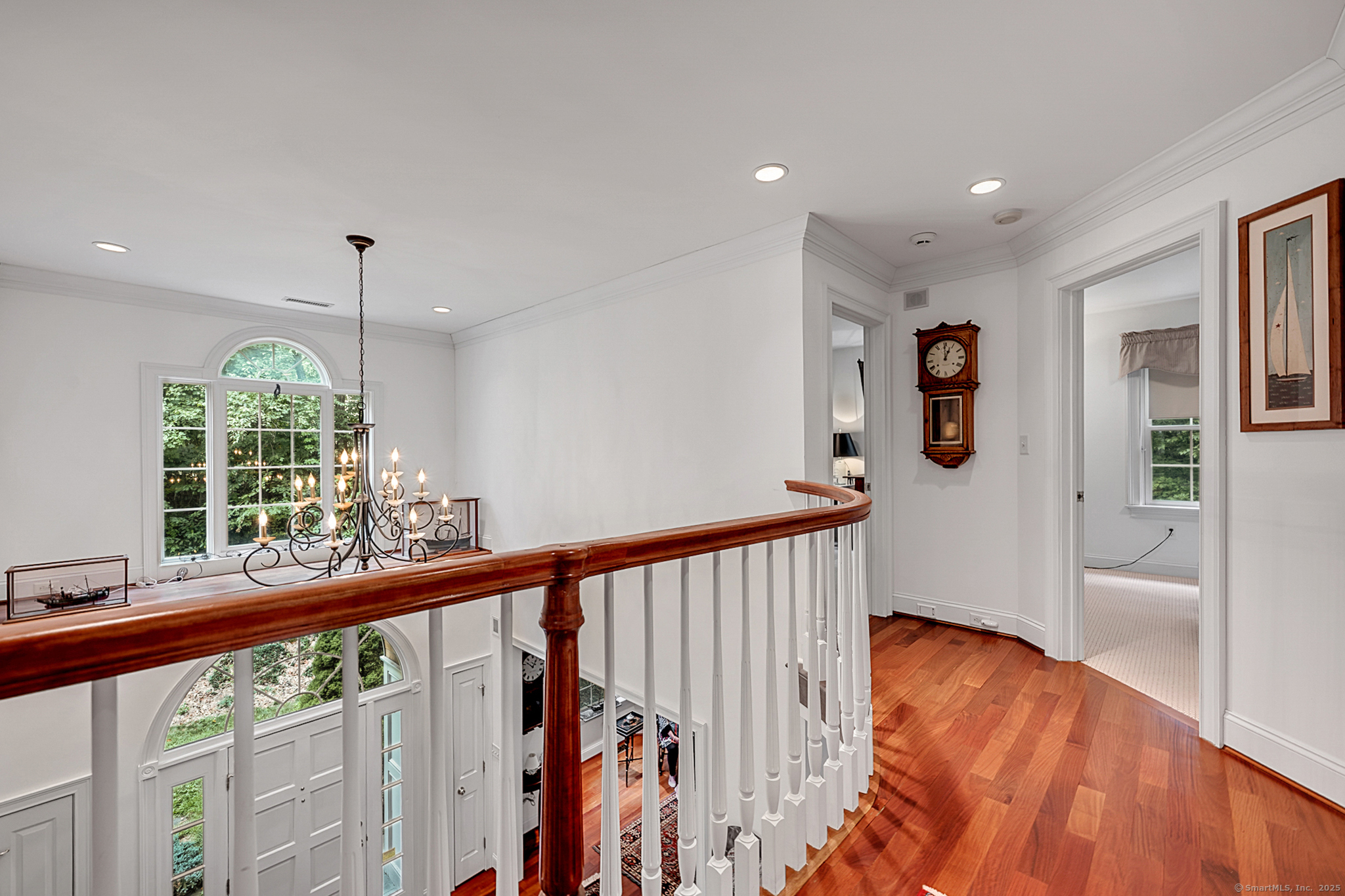 68 Hart Street Burlington, CT 06013 - Photo 20 of 39 a view of a hallway with wooden floor and stairs