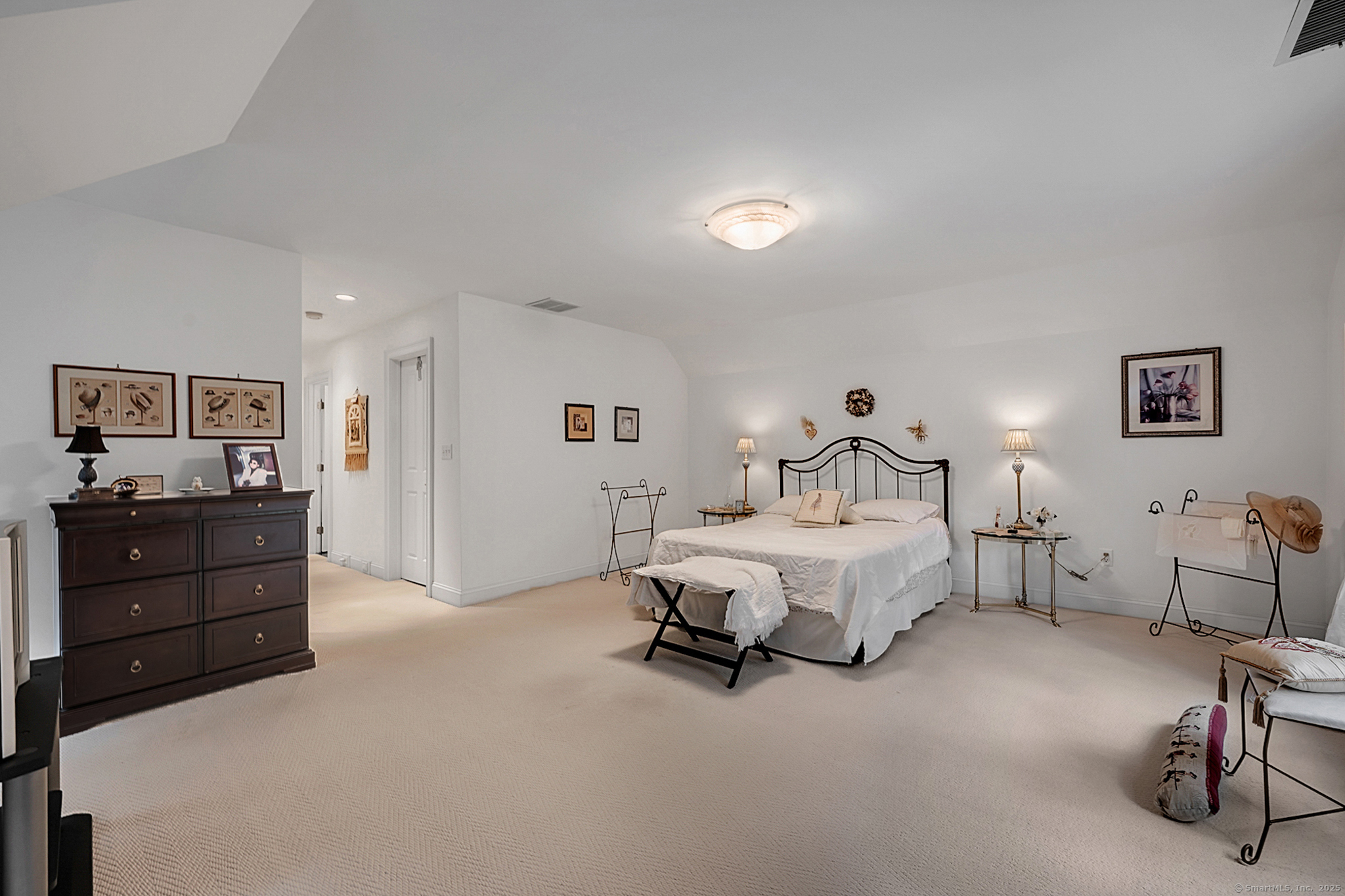 68 Hart Street Burlington, CT 06013 - Photo 21 of 39 a spacious bedroom with a bed and lamp