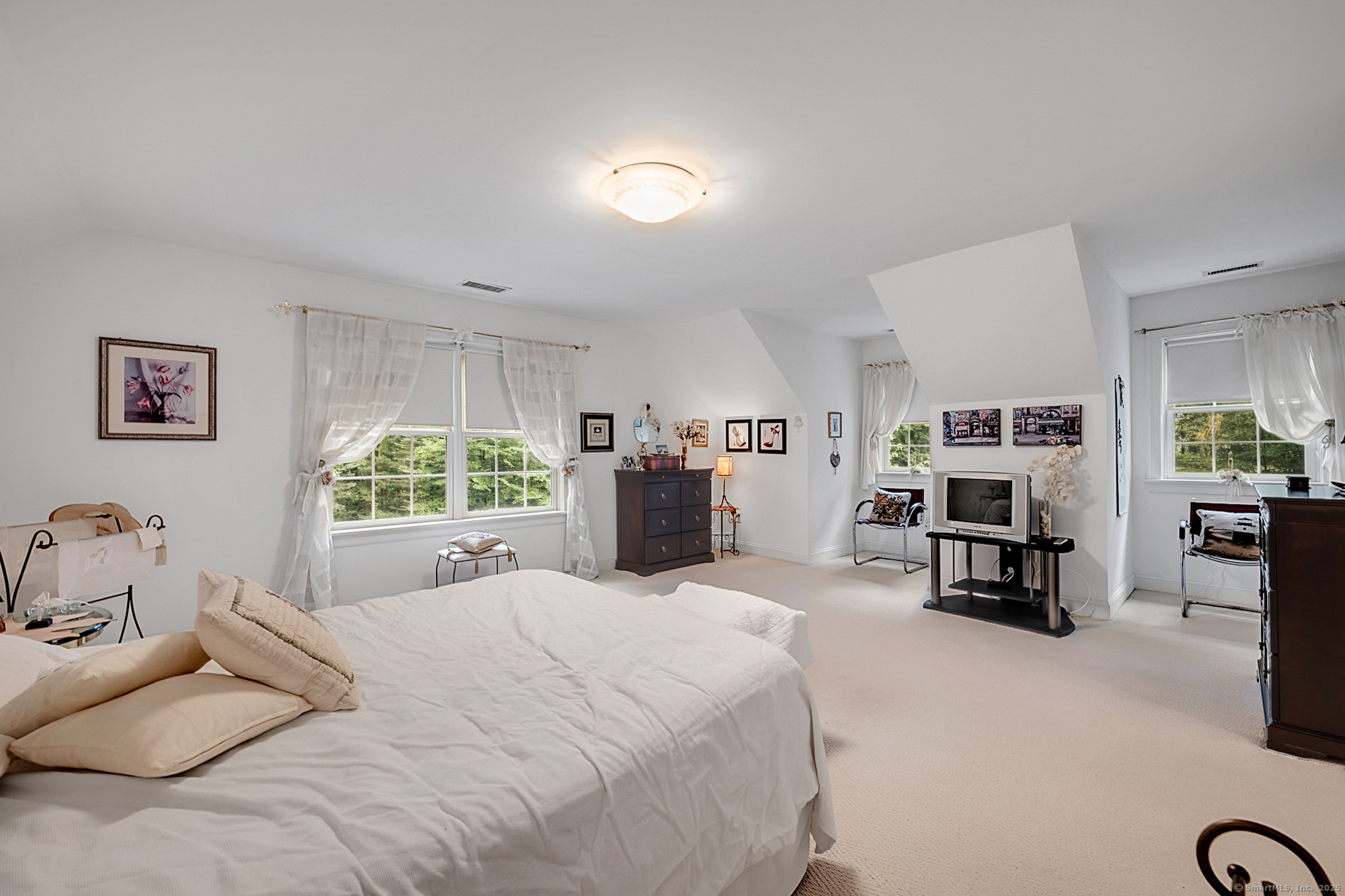 68 Hart Street Burlington, CT 06013 - Photo 23 of 39 a large bedroom with a bed furniture and a large window